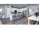 Modern kitchen featuring an island with bar seating, stainless appliances and open floor plan at 952 Morning Glory Rd, Brighton, CO 80640
