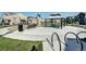 Community playground featuring a slide, climbing structure, benches, and covered picnic table at 952 Morning Glory Rd, Brighton, CO 80640