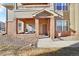 Charming condo with a covered front entrance and space for outdoor seating on the patio at 12764 Ironstone Way # 103, Parker, CO 80134