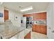 Well-equipped kitchen features stainless steel appliances, granite counters, and ample cabinet space at 12764 Ironstone Way # 103, Parker, CO 80134