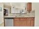 Stylish kitchen featuring granite countertops, stainless steel appliances, and modern cabinets at 12764 Ironstone Way # 103, Parker, CO 80134