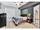 Relaxing main bedroom with a ceiling fan, and a large window that brings in natural light at 12764 Ironstone Way # 103, Parker, CO 80134
