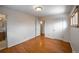 Hardwood floor bedroom with access to the bathroom and hallway at 1606 S Welch Cir, Lakewood, CO 80228