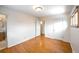 Comfortable bedroom featuring hardwood floors and ample closet space at 1606 S Welch Cir, Lakewood, CO 80228