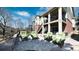 Spacious backyard patio with seating, a balcony, and well-maintained landscaping at 23426 E Ottawa Dr, Aurora, CO 80016