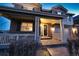 Charming brick home showcasing a welcoming front porch with classic white columns and manicured landscaping at 23426 E Ottawa Dr, Aurora, CO 80016