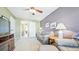 Cozy living room featuring neutral tones, ceiling fan, and a view of the bathroom at 23426 E Ottawa Dr, Aurora, CO 80016