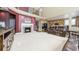 Comfortable living room with fireplace, plush seating, high ceilings, and an open layout connecting to the kitchen area at 23426 E Ottawa Dr, Aurora, CO 80016