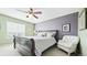 Charming bedroom with a ceiling fan, bright natural light, and decorative accents at 23426 E Ottawa Dr, Aurora, CO 80016