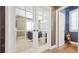 An office with french doors, desk, and built-in shelving at 23426 E Ottawa Dr, Aurora, CO 80016