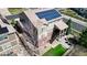 Backyard showcasing a patio, solar panels, and a two-story home with well-maintained landscaping at 23426 E Ottawa Dr, Aurora, CO 80016
