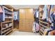 Large walk-in closet with custom shelving and storage solutions at 23426 E Ottawa Dr, Aurora, CO 80016