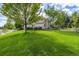 Expansive backyard featuring a lush lawn and white wooden fencing at 3901 Stonegrass Pt, Broomfield, CO 80023