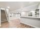 The basement features a bar, wood floor and carpet, and is ready for entertaining at 3901 Stonegrass Pt, Broomfield, CO 80023