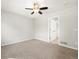 Bedroom with soft carpet, ceiling fan and doorway at 3901 Stonegrass Pt, Broomfield, CO 80023