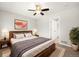 Bedroom with soft carpet, ceiling fan, bed and decorative accessories at 3901 Stonegrass Pt, Broomfield, CO 80023
