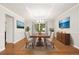 Formal dining room with decorative molding, lighting fixture and large window at 3901 Stonegrass Pt, Broomfield, CO 80023