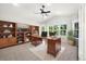 Bright office with carpet, built-in shelving and large windows at 3901 Stonegrass Pt, Broomfield, CO 80023