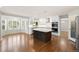 Spacious kitchen with stainless appliances and island is open to a sunny dining area at 3901 Stonegrass Pt, Broomfield, CO 80023