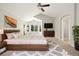 Main bedroom features a ceiling fan, carpet, and a bay window at 3901 Stonegrass Pt, Broomfield, CO 80023