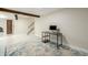 Unfinished basement area with a neutral color scheme with access to a door and visible staircase at 4620 W 108Th Pl, Westminster, CO 80031