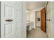 Bathroom with vanity, sink, closet, and a separate toilet area at 4620 W 108Th Pl, Westminster, CO 80031
