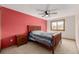 Warm bedroom featuring a large window, nightstand, and a ceiling fan at 4620 W 108Th Pl, Westminster, CO 80031