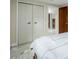Bedroom with modern closets and doorway leading to additional rooms with a consistent flooring style at 4620 W 108Th Pl, Westminster, CO 80031