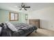 Inviting bedroom with a ceiling fan, dresser, and comfortable bed at 4620 W 108Th Pl, Westminster, CO 80031