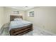 Well-lit bedroom featuring a wooden bed frame, plush bedding, and a cozy atmosphere enhanced by natural light at 4620 W 108Th Pl, Westminster, CO 80031