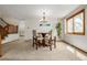 Charming dining area with counter-height seating, natural light, and views of backyard at 4620 W 108Th Pl, Westminster, CO 80031