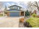 Charming two-story home featuring blue siding, brick accents, and a well-maintained front yard at 4620 W 108Th Pl, Westminster, CO 80031
