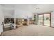 Spacious upstairs living room with slider to the backyard, overlooking a brick fireplace and built-ins at 4620 W 108Th Pl, Westminster, CO 80031