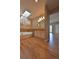 Bright bathroom with tub, double sinks, skylight, hardwood floors, and white cabinets at 23846 Genesee Village Rd, Golden, CO 80401