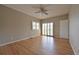 Bedroom showcasing hardwood floors, and a sliding door to the outdoor balcony at 23846 Genesee Village Rd, Golden, CO 80401