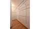 Bright walk-in closet with hardwood floors and wire shelving at 23846 Genesee Village Rd, Golden, CO 80401
