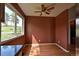 Cozy dining area with hardwood floors, a ceiling fan, and a large window with a view at 23846 Genesee Village Rd, Golden, CO 80401