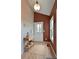 Warm and welcoming entryway with hardwood floors, a decorative door, and a stylish accent table at 23846 Genesee Village Rd, Golden, CO 80401