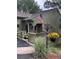 Charming front porch adorned with patriotic decorations and vibrant flowers, adding curb appeal at 23846 Genesee Village Rd, Golden, CO 80401