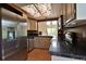 Well-lit kitchen with stainless steel appliances, dark granite countertops, and a decorative skylight at 23846 Genesee Village Rd, Golden, CO 80401