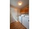 Laundry room with tile floors, washer, and dryer with upper cabinets at 23846 Genesee Village Rd, Golden, CO 80401