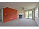 A carpeted living room boasts natural light, a fireplace, and access to the outside at 23846 Genesee Village Rd, Golden, CO 80401
