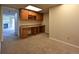A functional office space features built-in cabinets and a carpeted floor at 23846 Genesee Village Rd, Golden, CO 80401