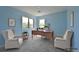 Comfortable office space with chairs, desk, and ample natural light at 23846 Genesee Village Rd, Golden, CO 80401