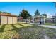 Backyard featuring an outdoor shed, patio, and a grassy yard at 16980 E Stanford Ave, Aurora, CO 80015