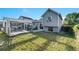Backyard features a deck, grassy yard, and a blue house at 16980 E Stanford Ave, Aurora, CO 80015