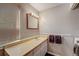 Bathroom features a vanity, sink, mirror, and a laundry machine at 16980 E Stanford Ave, Aurora, CO 80015