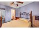Comfortable bedroom featuring a queen-sized bed and access to a private ensuite bathroom at 16980 E Stanford Ave, Aurora, CO 80015