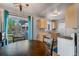Kitchen and breakfast nook with stainless steel appliances and hardwood floors at 16980 E Stanford Ave, Aurora, CO 80015