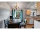 A sunny kitchen and breakfast nook with access to a backyard at 16980 E Stanford Ave, Aurora, CO 80015